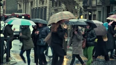 Umbrellas crossing in Rome